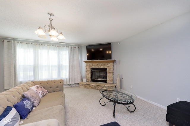 5646 Skipping Stone Dr, Indianapolis, IN 46237 - living area with a chandelier, carpet flooring, a stone fireplace, and baseboards