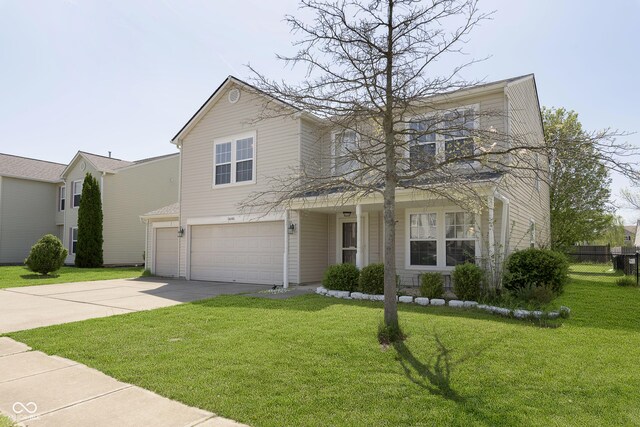 5646 Skipping Stone Dr, Indianapolis, IN 46237 - traditional home featuring an attached garage, driveway, and a porch