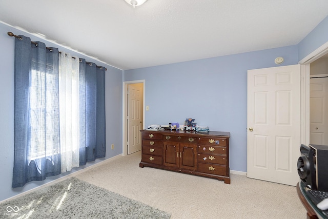 5646 Skipping Stone Dr, Indianapolis, IN 46237 - bedroom with multiple windows, carpet, and baseboards