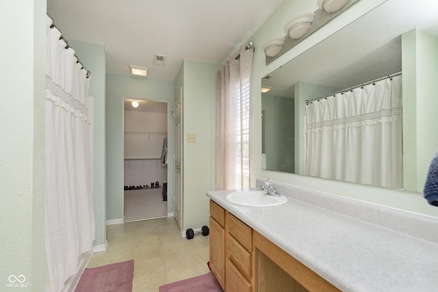 5646 Skipping Stone Dr, Indianapolis, IN 46237 - bathroom with vanity and baseboards