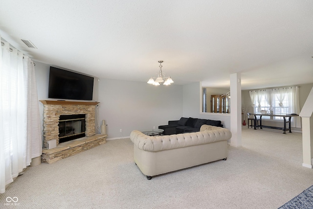 5646 Skipping Stone Dr, Indianapolis, IN 46237 - carpeted living room with a stone fireplace, baseboards, and a chandelier