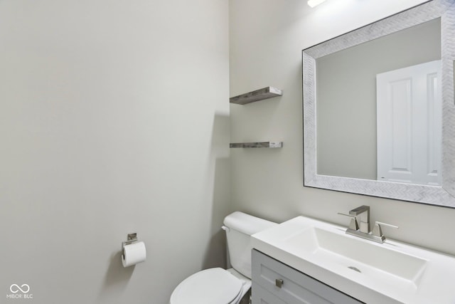 half bath with toilet and vanity