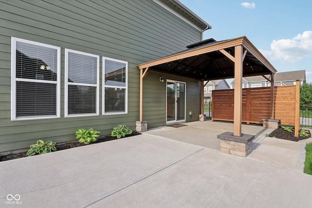 view of patio / terrace with a gazebo and fence