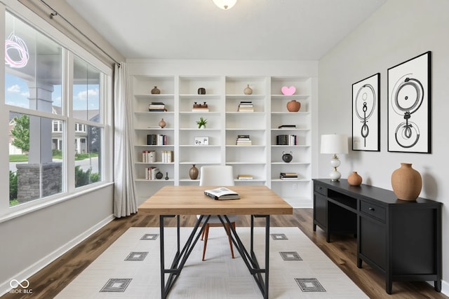 home office featuring dark wood finished floors and baseboards