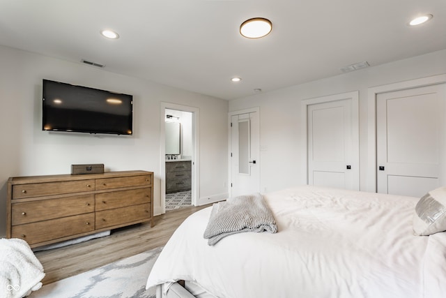 1534 Fletcher Ave, Indianapolis, IN 46203 - bedroom featuring light wood-style flooring, recessed lighting, and ensuite bath
