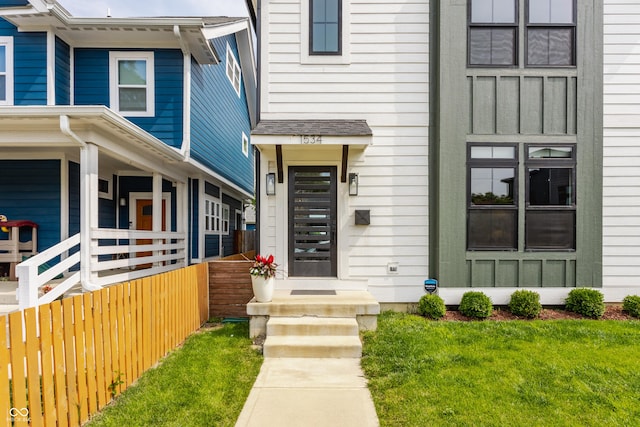 1534 Fletcher Ave, Indianapolis, IN 46203 - view of exterior entry with a lawn