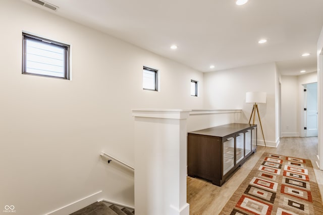 1534 Fletcher Ave, Indianapolis, IN 46203 - hallway featuring an upstairs landing, light wood-type flooring, and recessed lighting