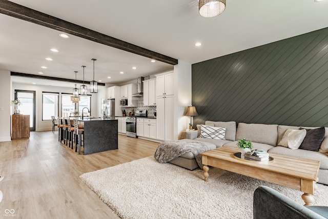1534 Fletcher Ave, Indianapolis, IN 46203 - living area featuring light wood-type flooring, recessed lighting, and beam ceiling