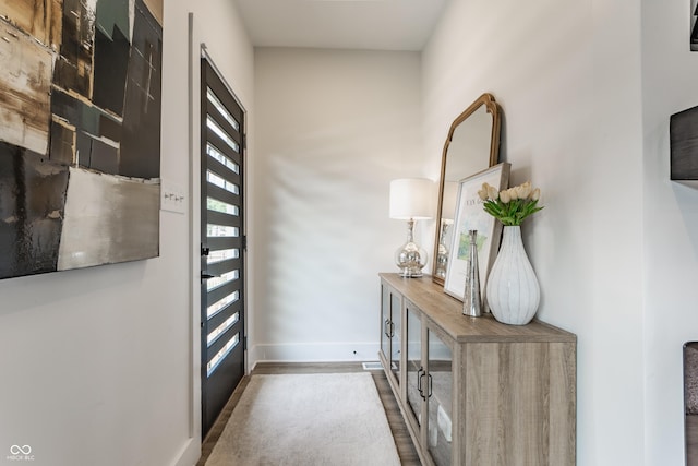 1534 Fletcher Ave, Indianapolis, IN 46203 - doorway to outside featuring baseboards and wood finished floors