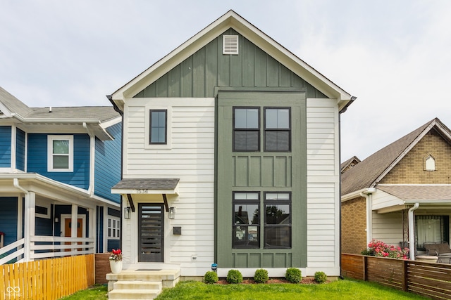 1534 Fletcher Ave, Indianapolis, IN 46203 - view of front of property with board and batten siding and a front lawn