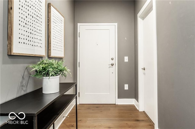 622 E 10th St Unit 212, Indianapolis, IN 46202 - doorway featuring baseboards and wood finished floors