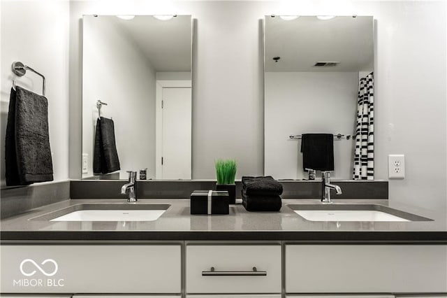 622 E 10th St Unit 212, Indianapolis, IN 46202 - full bath featuring double vanity, visible vents, and a sink