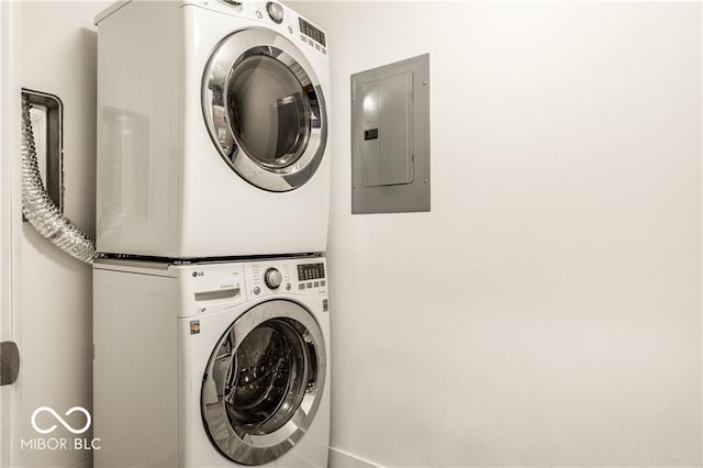 622 E 10th St Unit 212, Indianapolis, IN 46202 - clothes washing area featuring laundry area, stacked washing maching and dryer, and electric panel
