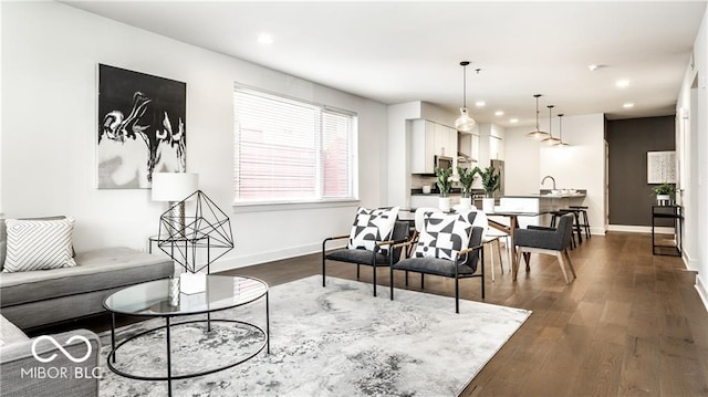 622 E 10th St Unit 212, Indianapolis, IN 46202 - living room with recessed lighting, baseboards, and dark wood-style floors
