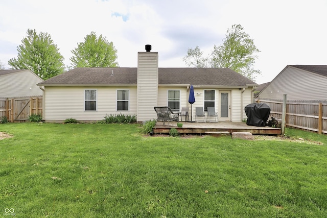 10688 Ashview Dr, Fishers, IN 46038 - back of property featuring a fenced backyard, a wooden deck, a yard, and a chimney