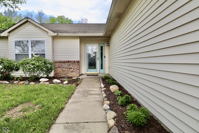10688 Ashview Dr, Fishers, IN 46038 - view of exterior entry with brick siding and roof with shingles