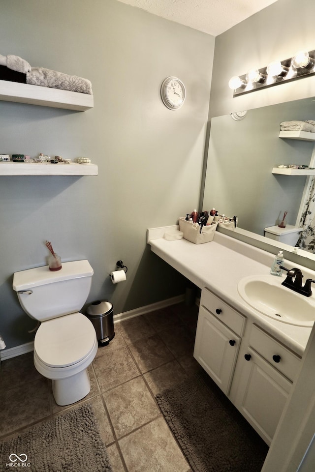 10688 Ashview Dr, Fishers, IN 46038 - bathroom with toilet, tile patterned floors, baseboards, and vanity