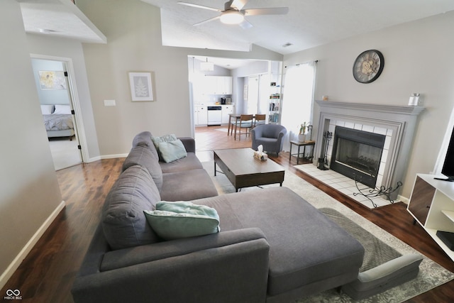 10688 Ashview Dr, Fishers, IN 46038 - living area featuring baseboards, ceiling fan, vaulted ceiling, and wood finished floors