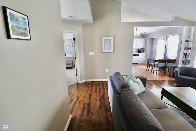 10688 Ashview Dr, Fishers, IN 46038 - living area featuring a textured ceiling, baseboards, and wood finished floors