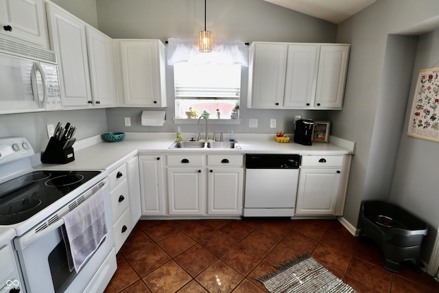 10688 Ashview Dr, Fishers, IN 46038 - kitchen featuring white appliances, dark tile patterned floors, white cabinets, a sink, and vaulted ceiling