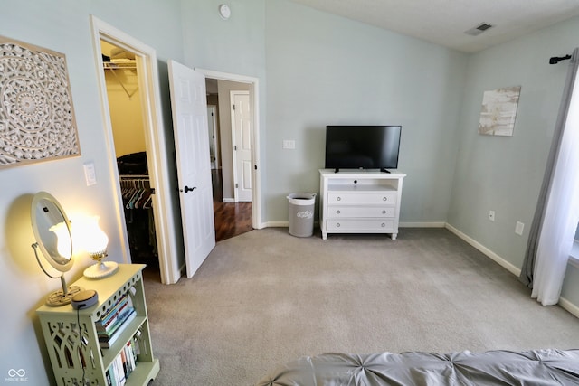 10688 Ashview Dr, Fishers, IN 46038 - bedroom with a walk in closet, visible vents, baseboards, a closet, and carpet flooring