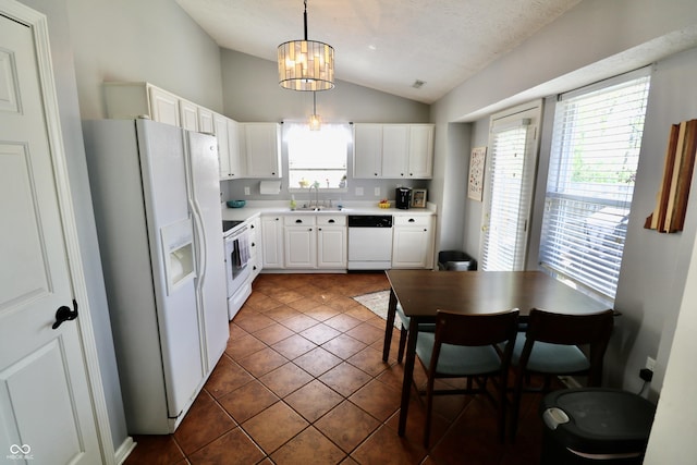 10688 Ashview Dr, Fishers, IN 46038 - kitchen featuring white appliances, light countertops, white cabinetry, a sink, and vaulted ceiling