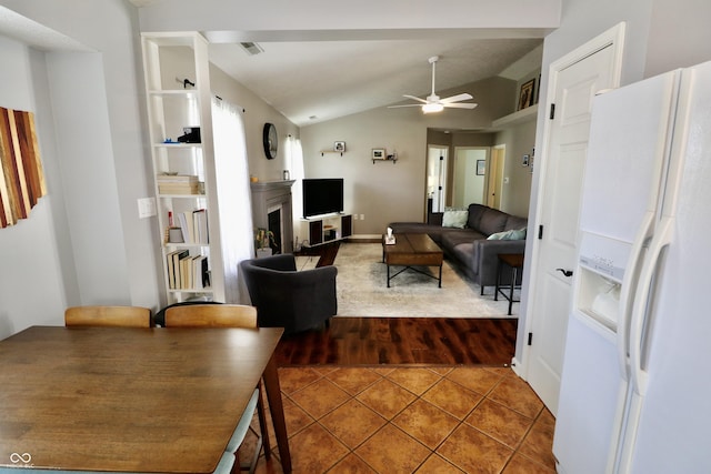 10688 Ashview Dr, Fishers, IN 46038 - living room featuring ceiling fan, tile patterned flooring, a fireplace, lofted ceiling, and visible vents