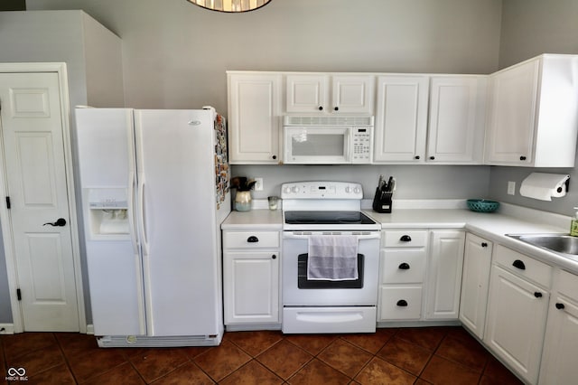 10688 Ashview Dr, Fishers, IN 46038 - kitchen featuring white cabinetry, white appliances, and dark tile patterned flooring