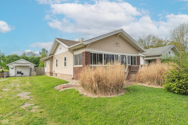 exterior space featuring a lawn, brick siding, and fence
