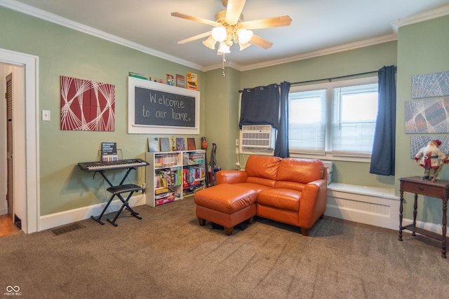 sitting room with carpet flooring, ceiling fan, ornamental molding, and cooling unit