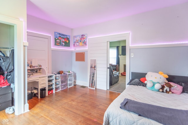 bedroom featuring wood finished floors