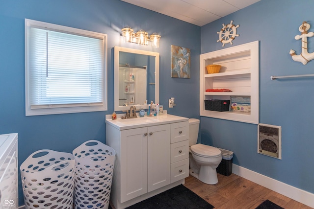 full bath featuring toilet, a shower with curtain, wood finished floors, and vanity