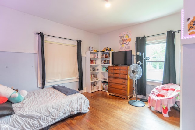 bedroom featuring wood finished floors