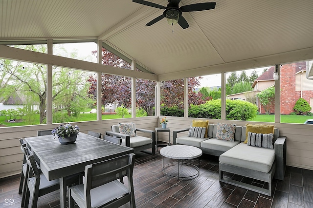 sunroom / solarium with ceiling fan, outdoor lounge area, and a wealth of natural light