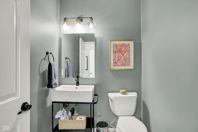 bathroom featuring toilet and a sink