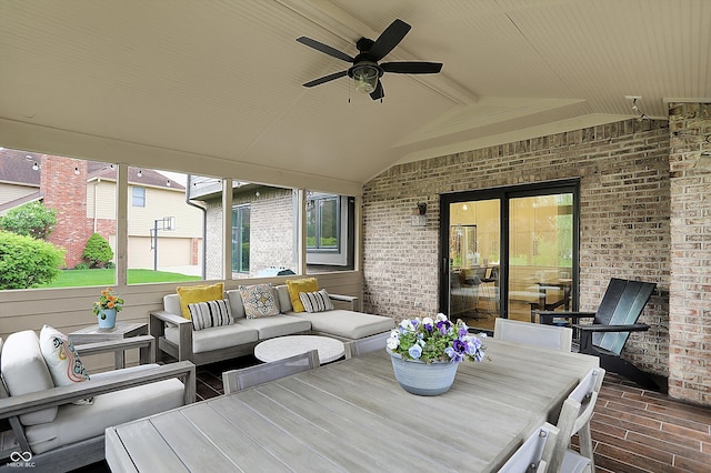 view of patio featuring outdoor dining area, ceiling fan, and outdoor lounge area