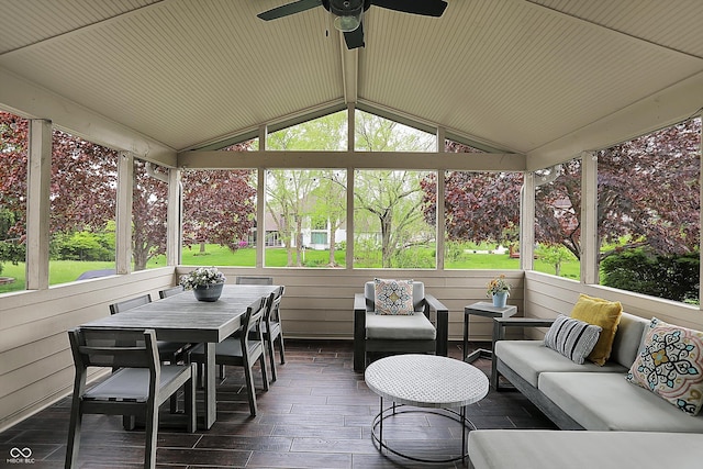 sunroom / solarium featuring a ceiling fan, outdoor lounge area, a wealth of natural light, and outdoor dining space