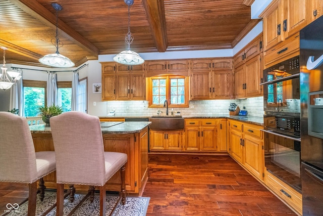 4401 W Hunters Ridge Ln W, Greenwood, IN 46143 - kitchen with a center island, a sink, wood ceiling, and dark wood-style floors