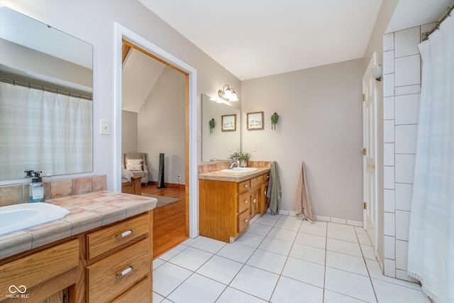 4401 W Hunters Ridge Ln W, Greenwood, IN 46143 - full bathroom featuring a sink, two vanities, and tile patterned floors