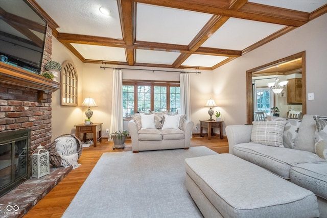4401 W Hunters Ridge Ln W, Greenwood, IN 46143 - living room featuring beam ceiling, a fireplace, baseboards, light wood-type flooring, and coffered ceiling