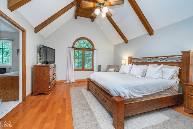 4401 W Hunters Ridge Ln W, Greenwood, IN 46143 - bedroom with high vaulted ceiling, light wood-type flooring, and beam ceiling