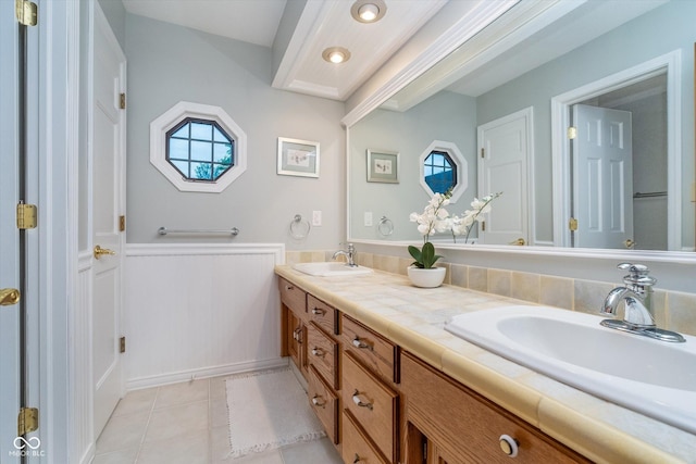 4401 W Hunters Ridge Ln W, Greenwood, IN 46143 - bathroom featuring a sink, tile patterned flooring, double vanity, and a wealth of natural light