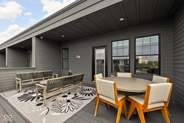wooden deck with outdoor lounge area and outdoor dining area