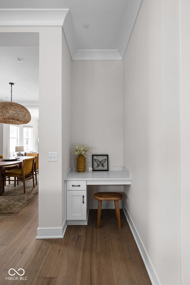 office with baseboards, crown molding, and hardwood / wood-style floors