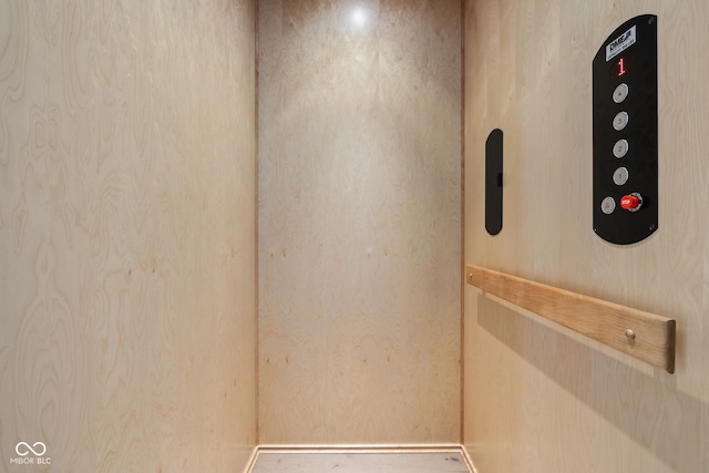 room details featuring baseboards and elevator