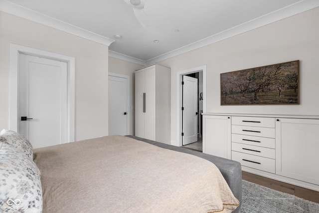 bedroom featuring dark wood-style floors and ornamental molding