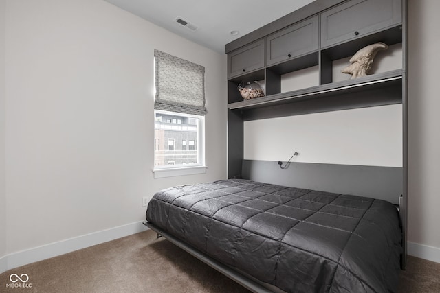 bedroom with baseboards, carpet flooring, and visible vents
