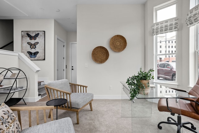 carpeted home office with baseboards