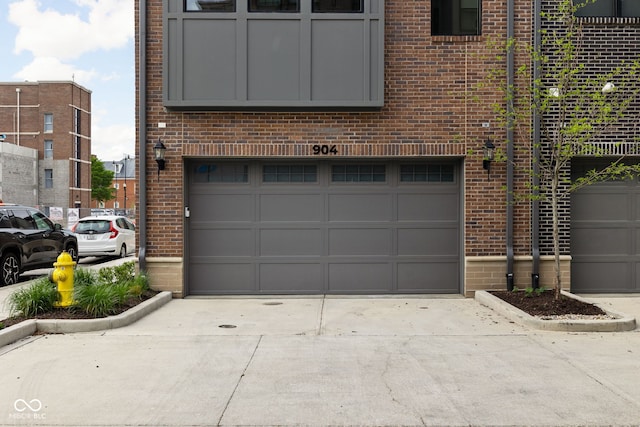 garage with concrete driveway