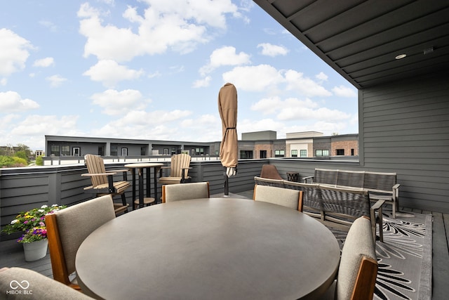 wooden deck featuring outdoor dining space